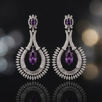 Pair of silver earrings with purple gemstones on a dark background