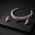 Jewelry set with a necklace and earrings on a dark surface