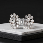 Diamond ring on a marble stand with a black background