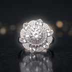 Diamond ring on a reflective surface with a dark background