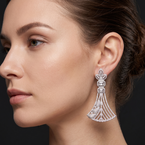 Close-up of a woman wearing a sparkling earring against a dark background