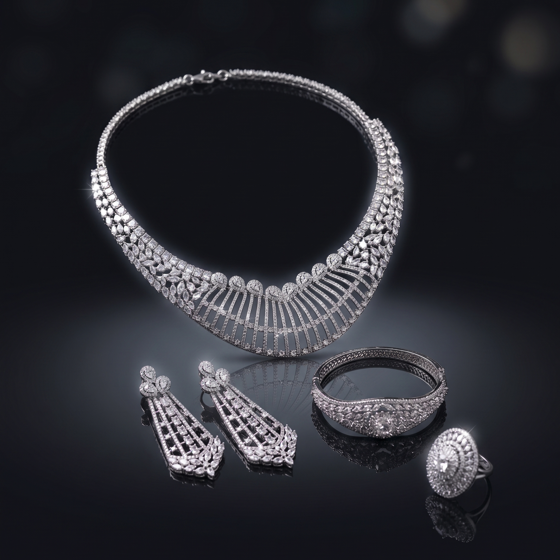 Silver jewelry set including necklace, earrings, bracelet, and ring on a dark background