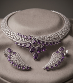 Jewelry set with necklace and earrings featuring purple gemstones on a gray surface.