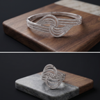 Silver bracelet and ring on wooden and stone surfaces