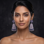 Woman wearing elegant earrings against a dark background