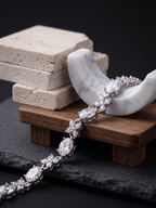 Diamond bracelet on a wooden stand with marble and stone background