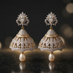 Pair of ornate earrings with pearls on a dark background