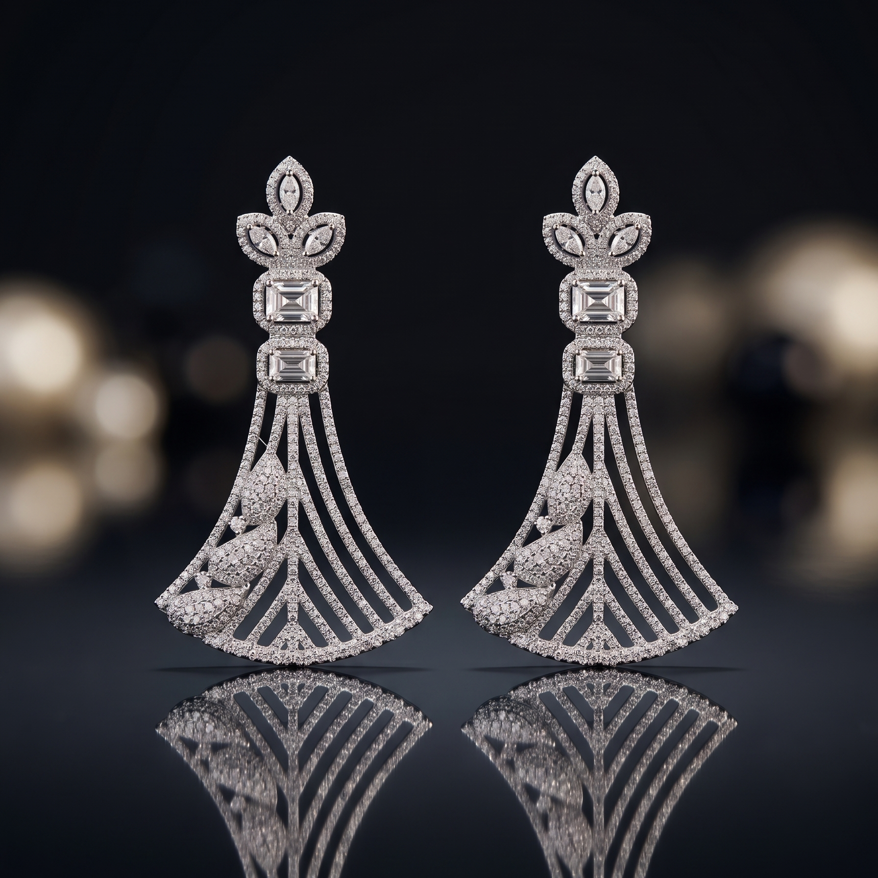 Pair of diamond earrings on a reflective surface with a blurred background