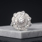 Diamond ring on a marble surface with a black background